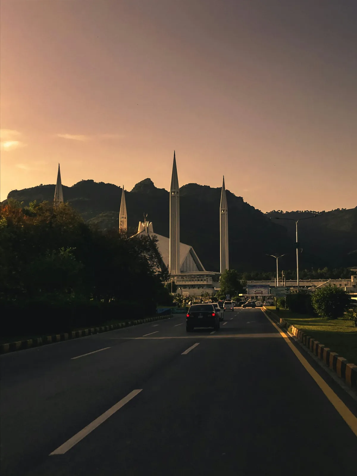 Avenue at dusk in the Zone IV corridor near DHA Margalla Enclave, Islamabad